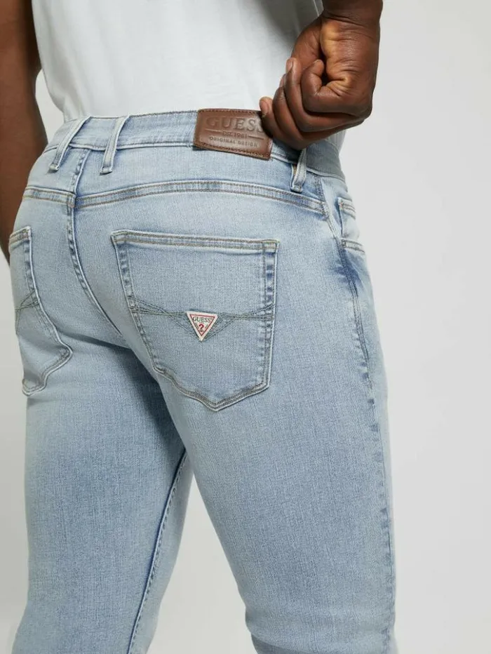 Men GUESS Jeans and Denim Distressed LowRise Slim Straight Jeans Light Sail
